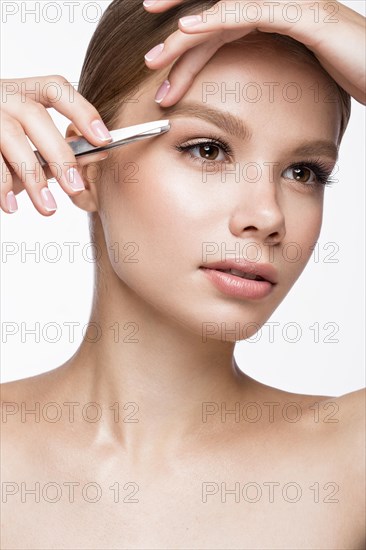 Beautiful young girl with a light natural make-up