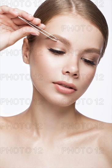 Beautiful young girl with a light natural make-up