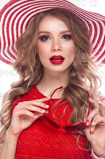 Bright cheerful girl in a summer hat