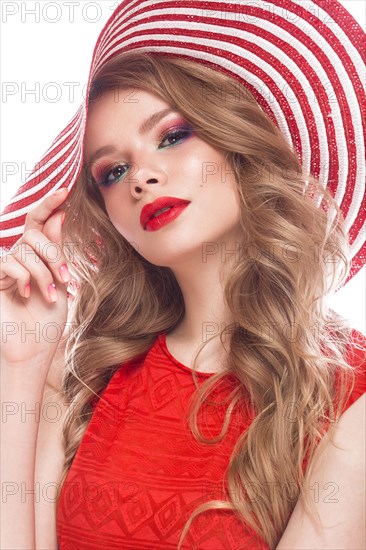 Bright cheerful girl in a summer hat