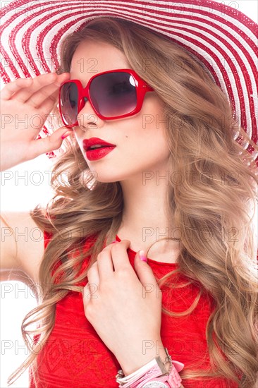 Bright cheerful girl in a summer hat