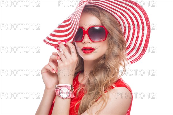 Bright cheerful girl in a summer hat