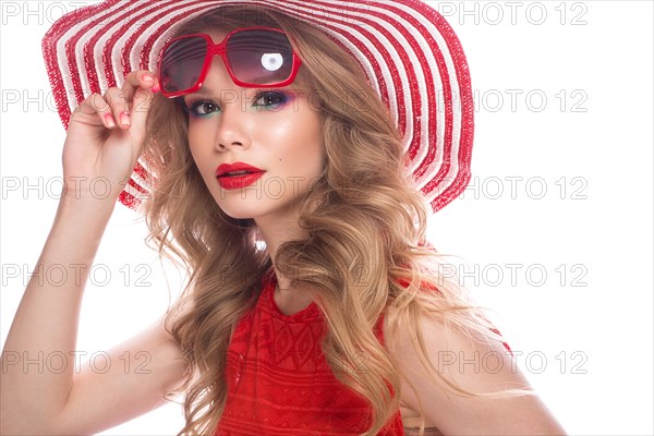 Bright cheerful girl in a summer hat