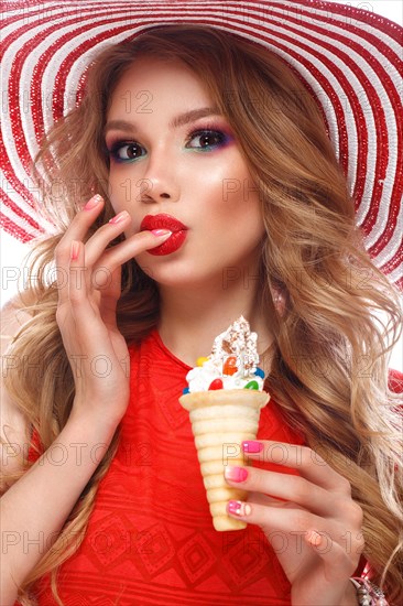 Bright cheerful girl in a summer hat