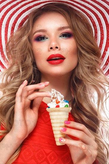 Bright cheerful girl in a summer hat