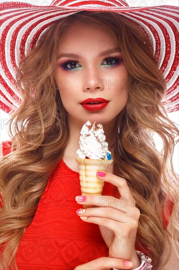 Bright cheerful girl in a summer hat