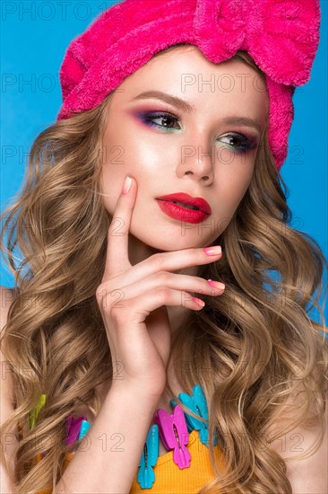 Bright cheerful girl in a home hat