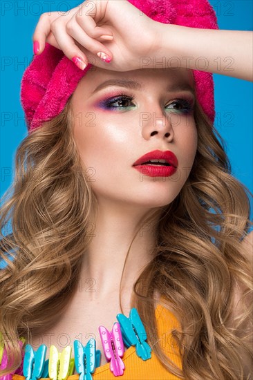 Bright cheerful girl in a home hat