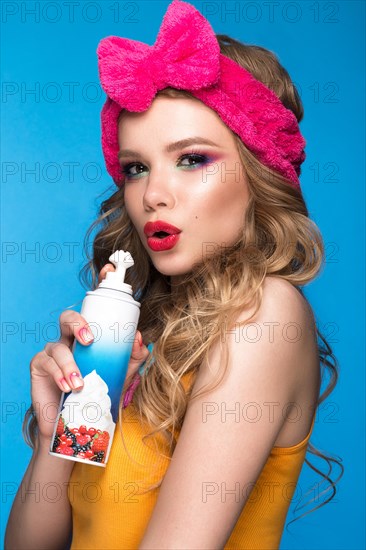 Bright cheerful girl in a home hat