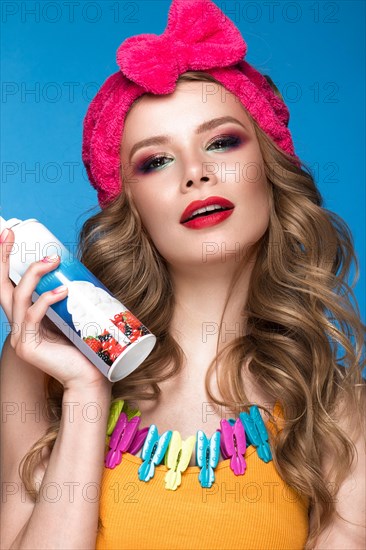 Bright cheerful girl in a home hat