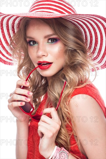 Bright cheerful girl in a summer hat