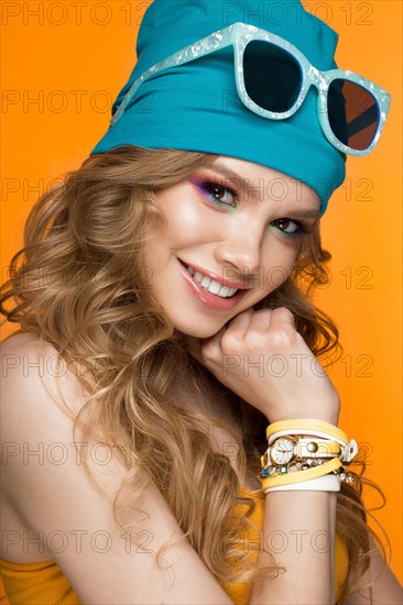 Bright cheerful girl in a sports hat