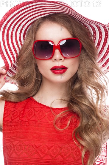 Bright cheerful girl in a summer hat