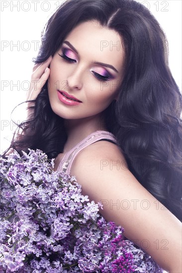 Beautiful brunette girl with a gentle romantic make-up