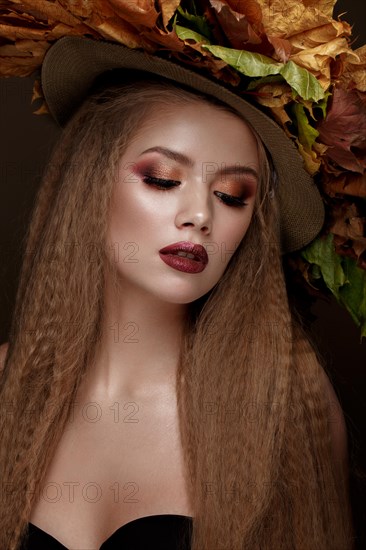 Beautiful blond model autumn hat with curls