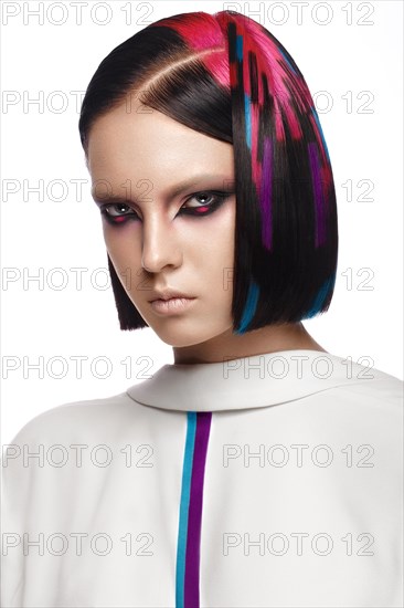 Portrait of beautiful woman with multi-colored hair and creative make up and hairstyle