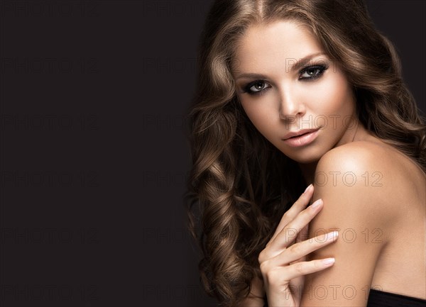 Beautiful woman with evening make-up and long straight hair