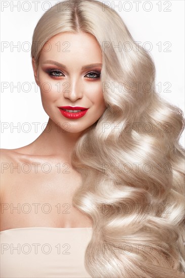 Beautiful blonde in a Hollywood manner with curls