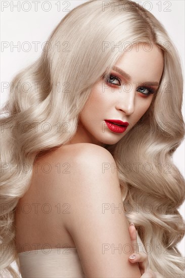 Beautiful blonde in a Hollywood manner with curls