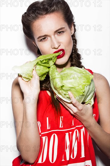 Daring funny girl with braids and red lips