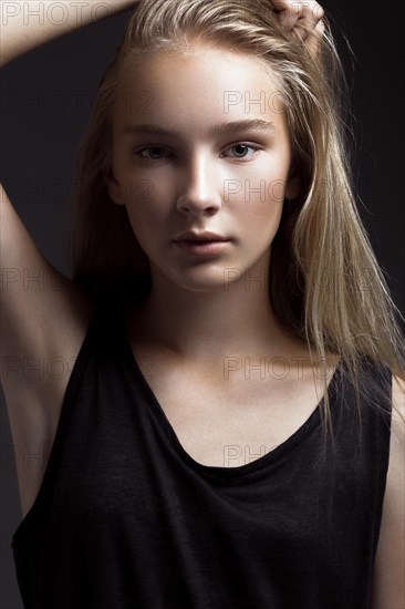 Fashion model is posing in studio for test photo shoot showing different poses