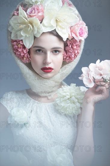 Beautiful girl in a headscarf in the Russian style