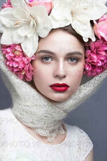 Beautiful girl in a headscarf in the Russian style