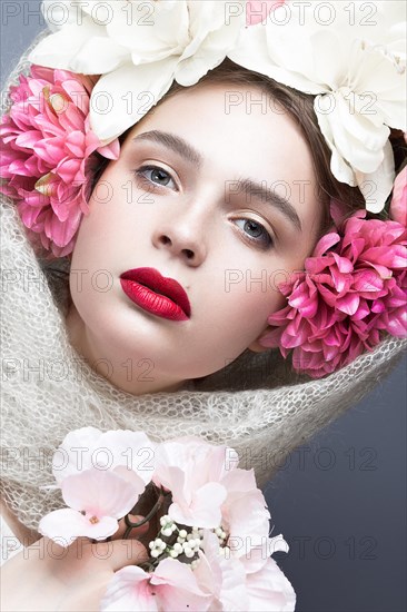 Beautiful girl in a headscarf in the Russian style