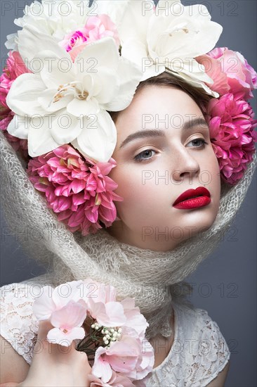 Beautiful girl in a headscarf in the Russian style