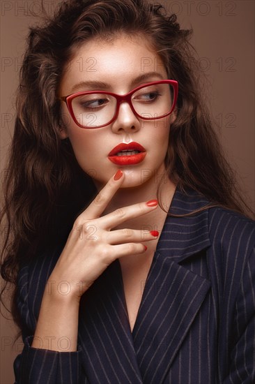 Beautiful girl in stylish clothes with glasses for vision. Beauty face. Photo taken in the studio