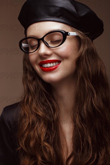 Beautiful girl in stylish clothes with glasses for vision and red sexy lips. Beauty face. Photo taken in the studio