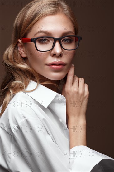 Beautiful girl in stylish clothes with glasses for vision and red sexy lips. Beauty face. Photo taken in the studio