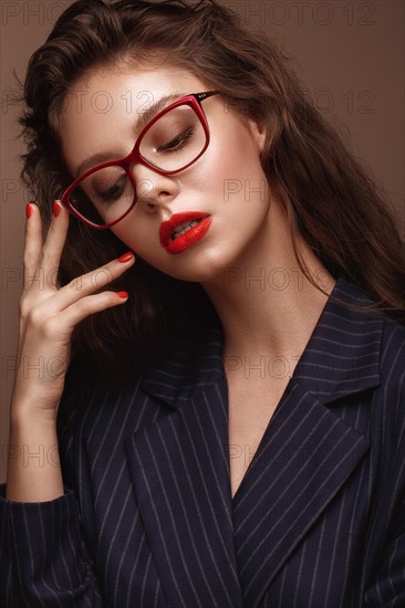 Beautiful girl in stylish clothes with glasses for vision. Beauty face. Photo taken in the studio