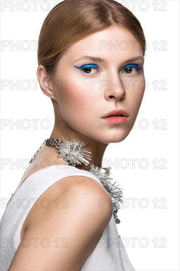 Beautiful fashionable girl with the blue arrows on the eyes