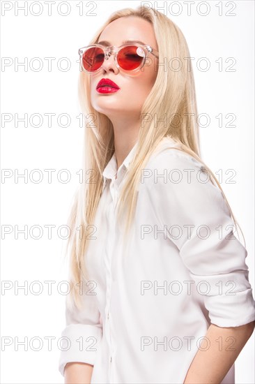 Beautiful blonde girl in pink glasses and white shirt. Beauty the face. Isolated on white background