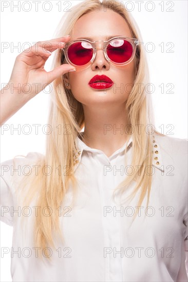 Beautiful blonde girl in pink glasses and white shirt. Beauty the face. Isolated on white background