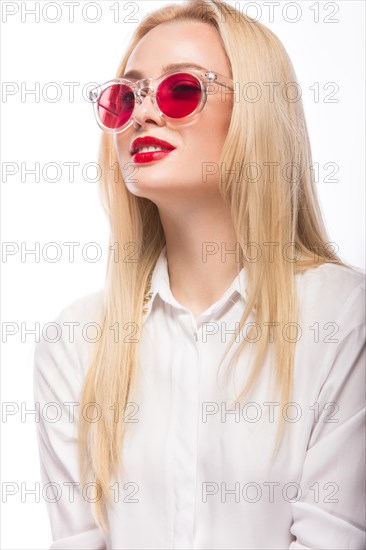Beautiful blonde girl in pink glasses and white shirt. Beauty the face. Isolated on white background