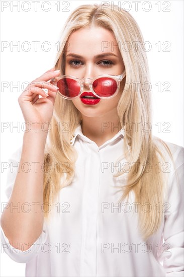 Beautiful blonde girl in pink glasses and white shirt. Beauty the face. Isolated on white background