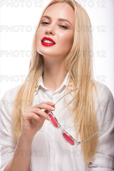 Beautiful blonde girl in pink glasses and white shirt. Beauty the face. Isolated on white background