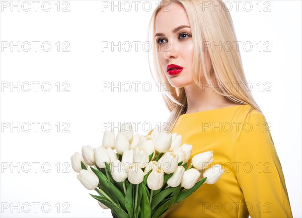 Portrait of beautiful fashion model with bouquet lily in hands