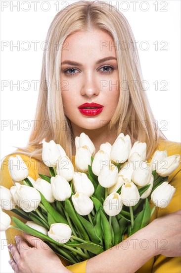 Portrait of beautiful fashion model with bouquet lily in hands