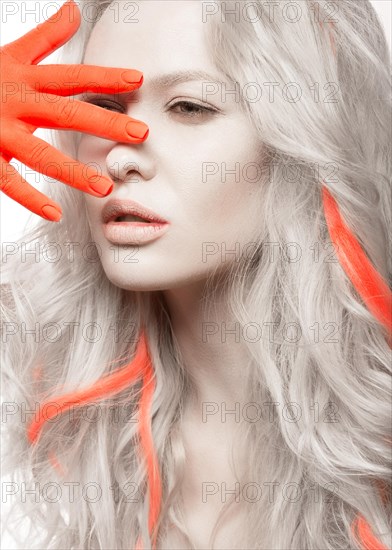 Art fashion girl with white skin in the form of albinos with red arms and a lock of hair. Creative image of beauty. Photos shot in studio