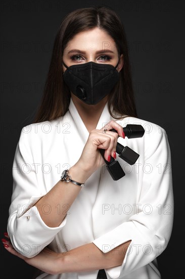 Manicurist in working form in black mask.. Nail photo content