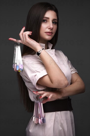 Manicurist in working form with tools in hand. Nail photo content