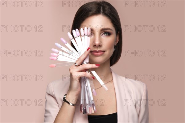 Manicurist in working form with tools in hand. Nail photo content