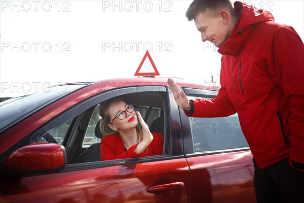 The driver is an auto school instructor and a female student on an examination car. Lesson at the circuit