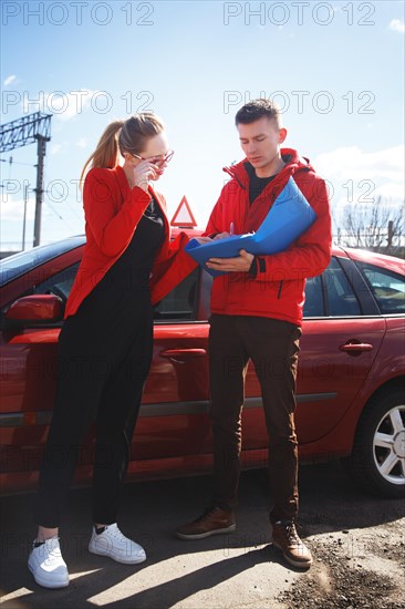 The driver is an auto school instructor and a female student on an examination car. Lesson at the circuit