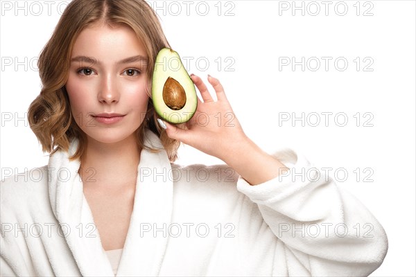 Beautiful tender young girl in a white coat with clean fresh skin posing in front of the camera. Beauty face. Skin care. Photo taken in studio on a white isolate background