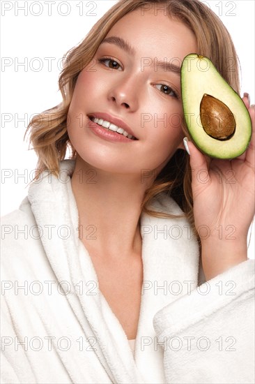 Beautiful tender young girl in a white coat with clean fresh skin posing in front of the camera. Beauty face. Skin care. Photo taken in studio on a white isolate background