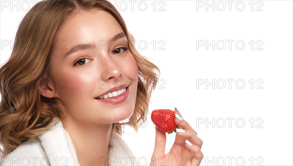 Beautiful tender young girl in a white coat with clean fresh skin posing in front of the camera. Beauty face. Skin care. Photo taken in studio on a white isolate background